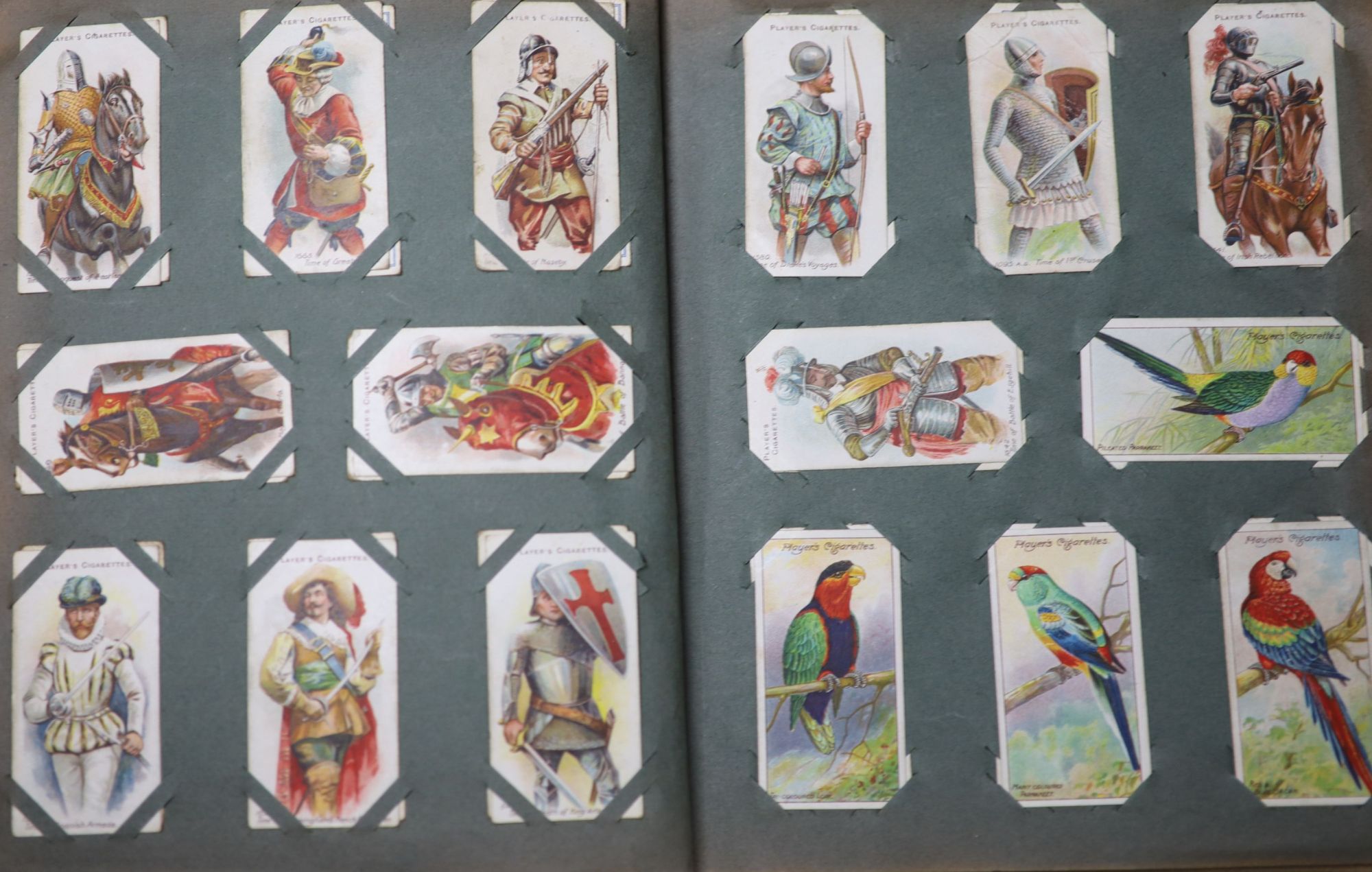 A collection of assorted cigarette cards and tea cards